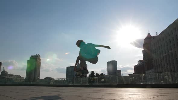 Skater Falling While Doing Ollie Trick with Grab