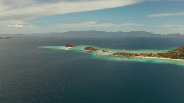 Small Torpic Island with a White Sandy Beach, Top View.