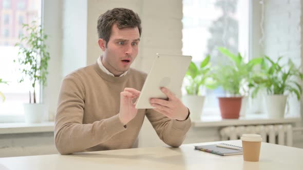 Man Making Video Call on Tablet in Office