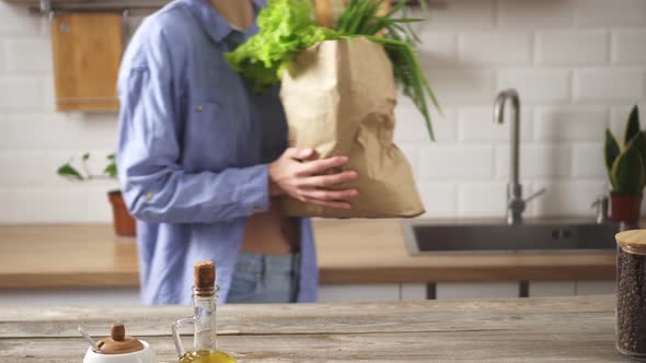 Young Woman With Paper Eco Bag Full Of Fresh Organic Products. Housewife Brings In