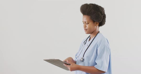 Portrait of happy african american female doctor looking at camera and smiling