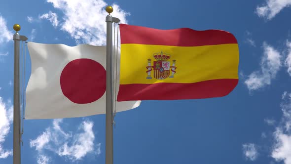 Japan Flag Vs Spain Flag On Flagpole