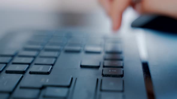 Closeup Mans Hand Typing on a Computer Keyboard