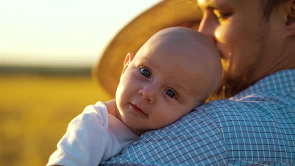 Baby Putting Head on Shoulder of Daddy