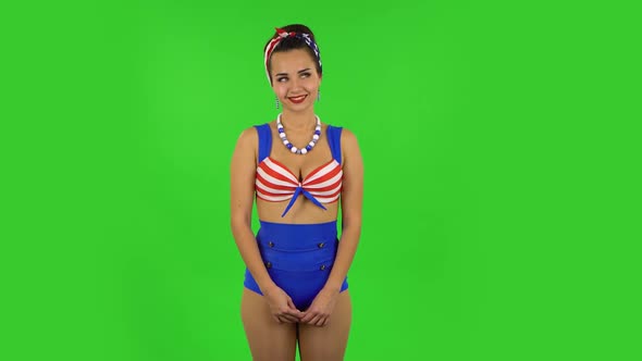 Beautiful Girl in a Swimsuit in Anticipation of Worries, Then Proud of Himself. Green Screen