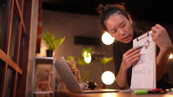 Young Asian woman person using computer laptop videos conference online with friends for education.