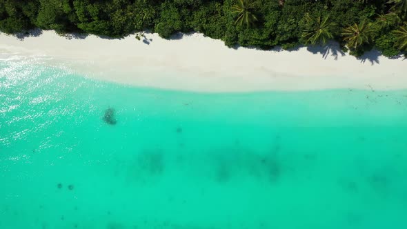 Aerial landscape of idyllic sea view beach trip by blue ocean with white sandy background of a dayou