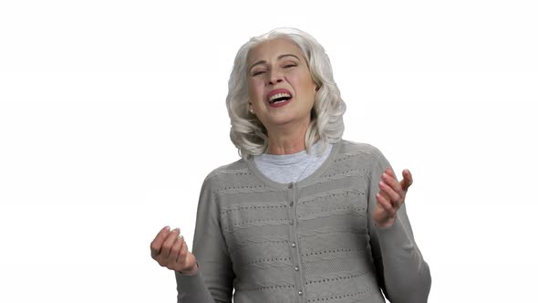 Portrait of Mature Woman is Laughing on White Background