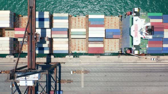 Aerial View Industrial Crane Unloading Containers From Vessel in Port Miami