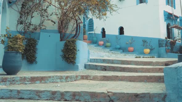 Empty street first person view in Chefchaouen Morocco, point of view of touristic narrow alley with