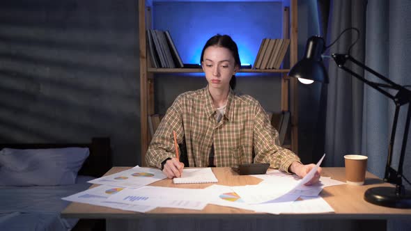 Asian Korean College Girl Preparing for Exams at Home in Dark Bedroom at Night