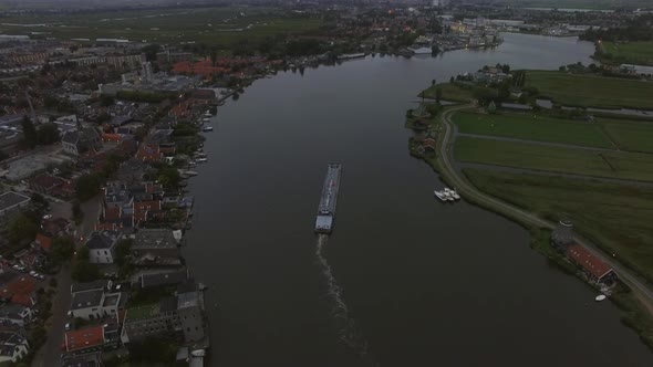 Aerial View of Town and River with Sailing Ship, Netherlands