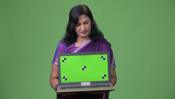Mature Beautiful Indian Woman As Call Center Representative Showing Laptop