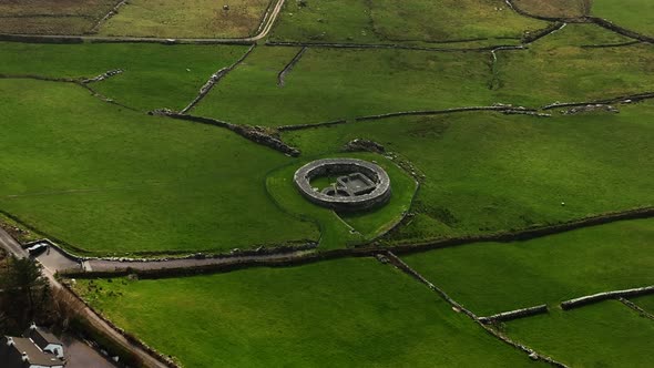 Loher Ringfort, Kerry, Ireland, March 2022. Drone orbits the ancient monument from the north while p