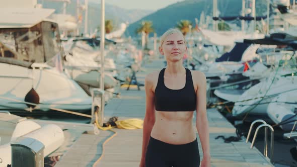 Fitness Woman Enjoying Early Morning Walking in City Quay