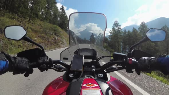 POV Biker Rides on Motorbike By Scenic Green Mountain Road Swiss Alp Moto Trip