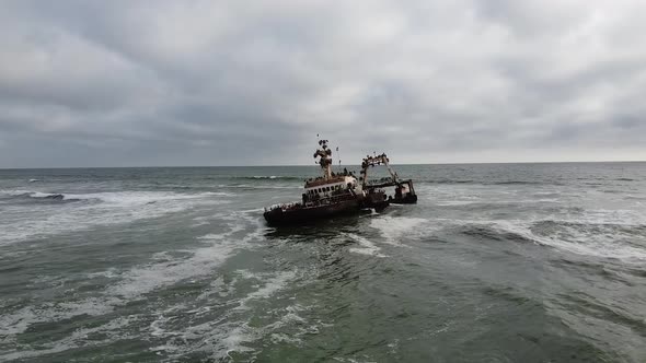 Sunken ship in the ocean, creepy rusty ship surrounded by the wavy ocean