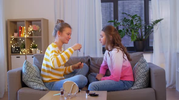 Happy Teenage Girls Doing Make Up at Home