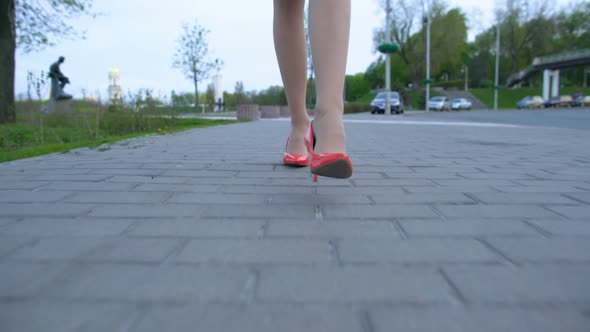 Drunk Woman Wearing Red High Heel Shoes Walking Home After Party Celebration