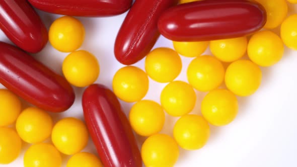 pills close-up. round yellow and red capsule pills close up