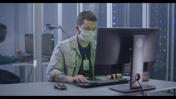 Young Man Working in Data Center