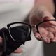 Woman Holds Eyeglasses in Hands - VideoHive Item for Sale