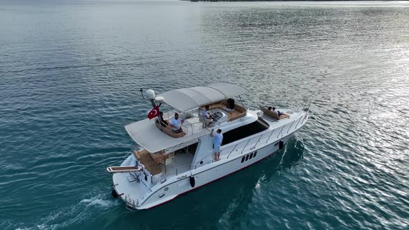 A couple rides a yacht aerial view 4 K Turkey Alanya