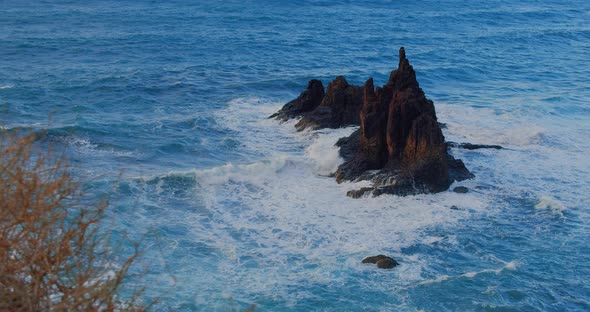 Big Waves Crash Into the Black Volcanic Rocks on the Remote Shore of Tenerife Island