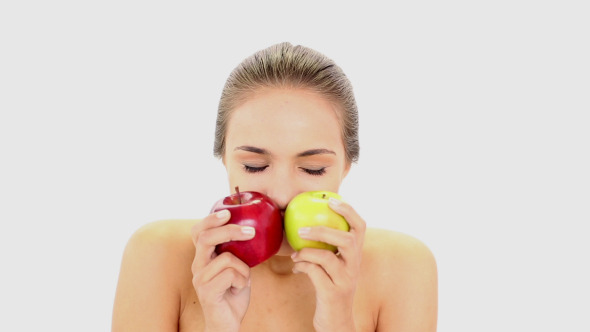 Beautiful Model Holding Red And Green Apples
