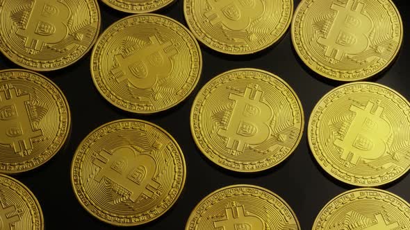 Rotating shot of Bitcoins (digital cryptocurrency) - BITCOIN