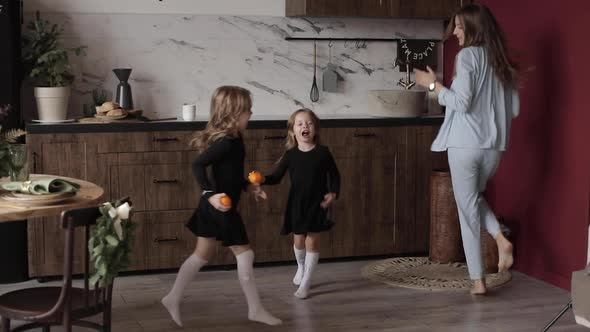 Dancing Young Mother Daughters Having Fun Festive Holidays Together Xmas Decorated Kitchen