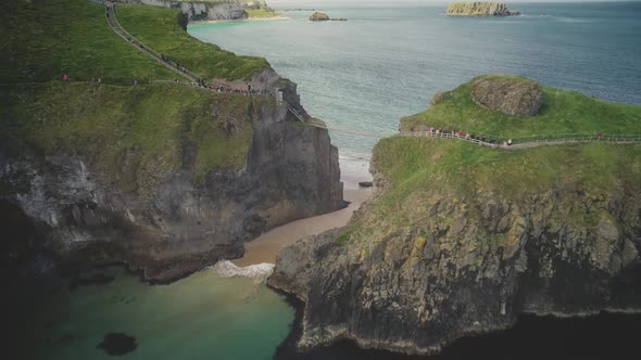 Carrick-a-Rede Aerial View: Irish Rope Bridge in Front of Seascape. Picturesque Landmark