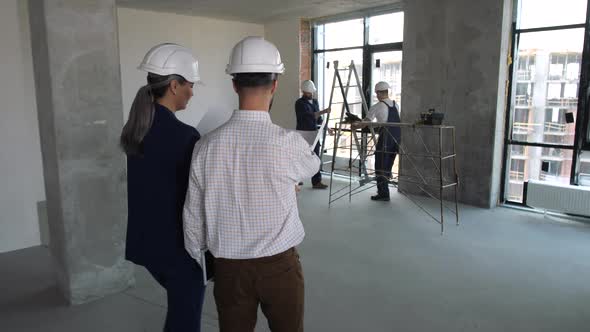 Architects Inside Newly Built Apartment Building