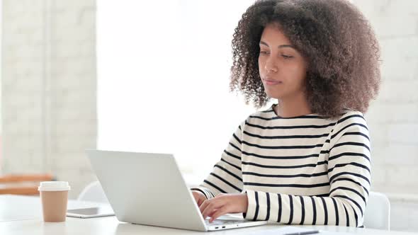 African Woman Working on Laptop 