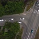 Top View Tracking From a Height of a Cortege of White Cars Traveling on the Road of the City - VideoHive Item for Sale