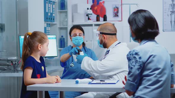 Nurse Giving Pills to Doctor