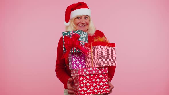 Grandmother Old Woman in Christmas Santa Sweater Holding Many Gift Boxes New Year Presents Shopping