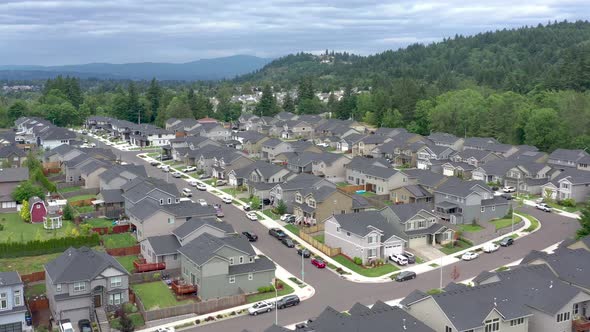 Aerial view of houses in a safe, clean subdivision where typical American families live.