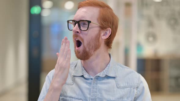 Portrait of Sleepy Casual Redhead Man Yawning