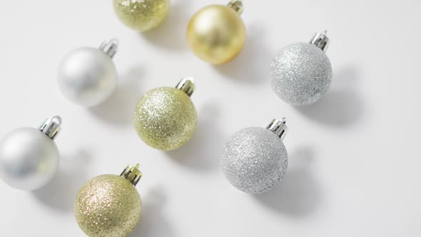 Video of christmas baubles and copy space on white background