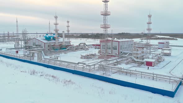 In the Winter an Oil and Gas Field Was Removed From the Drone Fenced Off By a Blue Fence