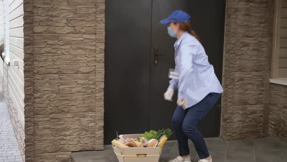 Shop Delivery, Courier Wearing Protective Masks and Gloves Delivers a Basket of Groceries From Store