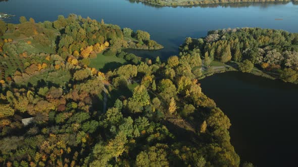 Flight Over The Autumn Park. Park On The Shore Of A Large Lake