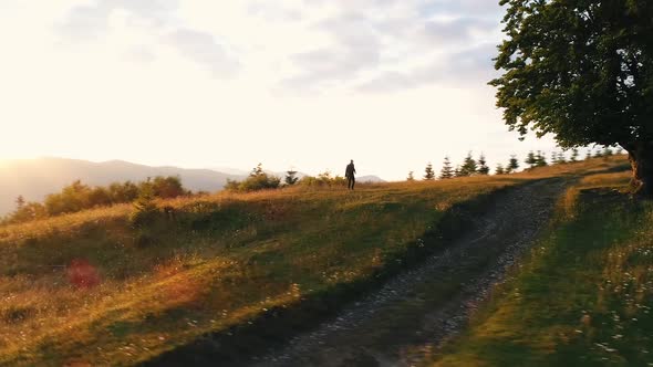 the Guy Moves Among Nature and Mountains Aerial View