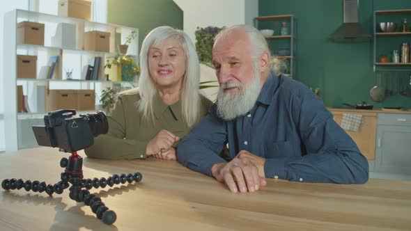 An Elderly Couple Is Vlogging Making Content For Vlogging in a Cozy Living Room