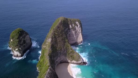 Stunning aerial view flight sideways for a adventure commercial advertisingKelingking Beach at Nusa