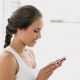Fit Young Woman Sending A Text On Smartphone - VideoHive Item for Sale