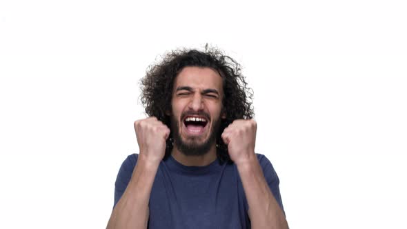 Portrait of Brunette Brazilian Man Gesturing Emotionally and Expressing Success or Good Result