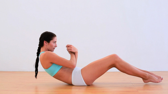 Fit Brunette Doing Abdominal Crunches