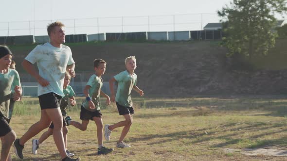 Group of Caucasian children training at boot camp